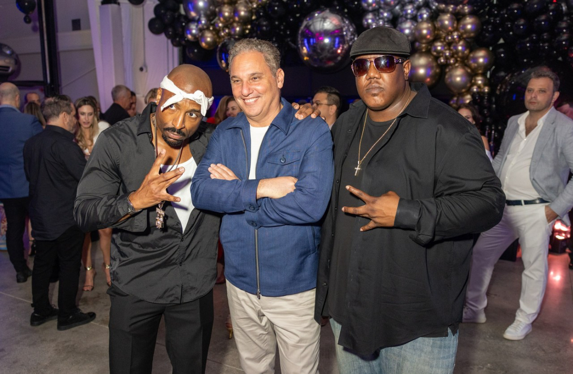 Edward Williams III with Tupac tribute performer at an event