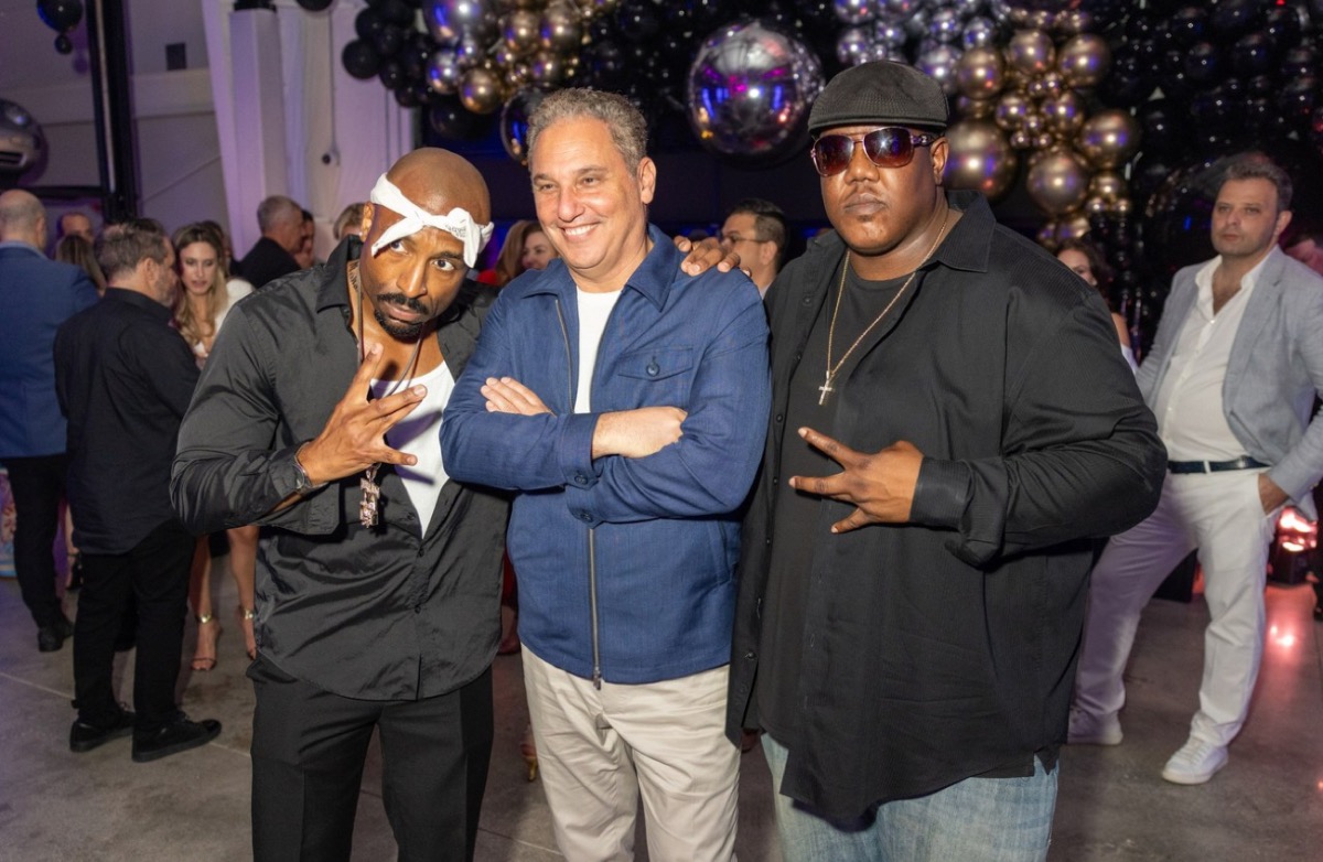Edward Williams III with Tupac tribute performer at an event
