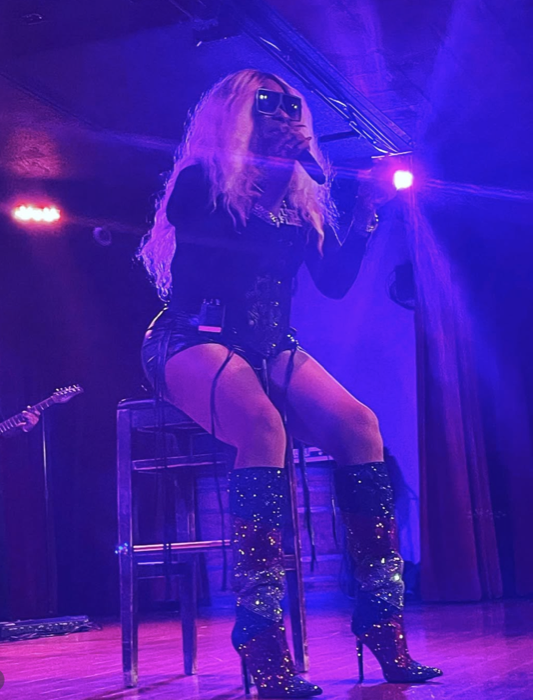 Tre’Jae seated during a live Mary J. Blige tribute performance