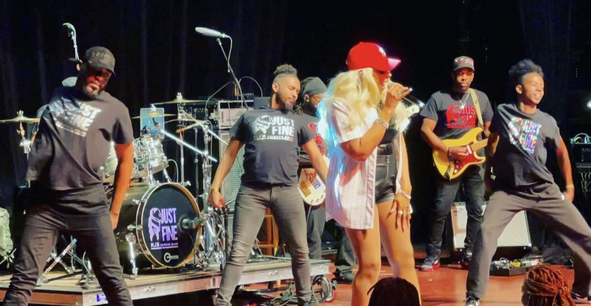 Tre’Jae surrounded by her live performance ensemble