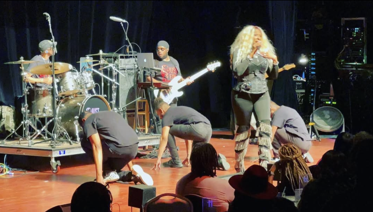 Tre’Jae performing with her live band