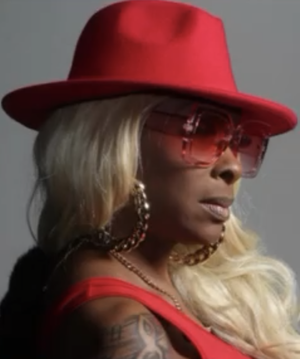 Tre’Jae wearing a red hat and sunglasses