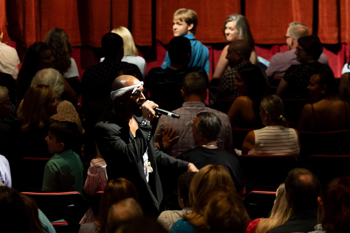 Josh Harraway as Tupac performing in the crowd