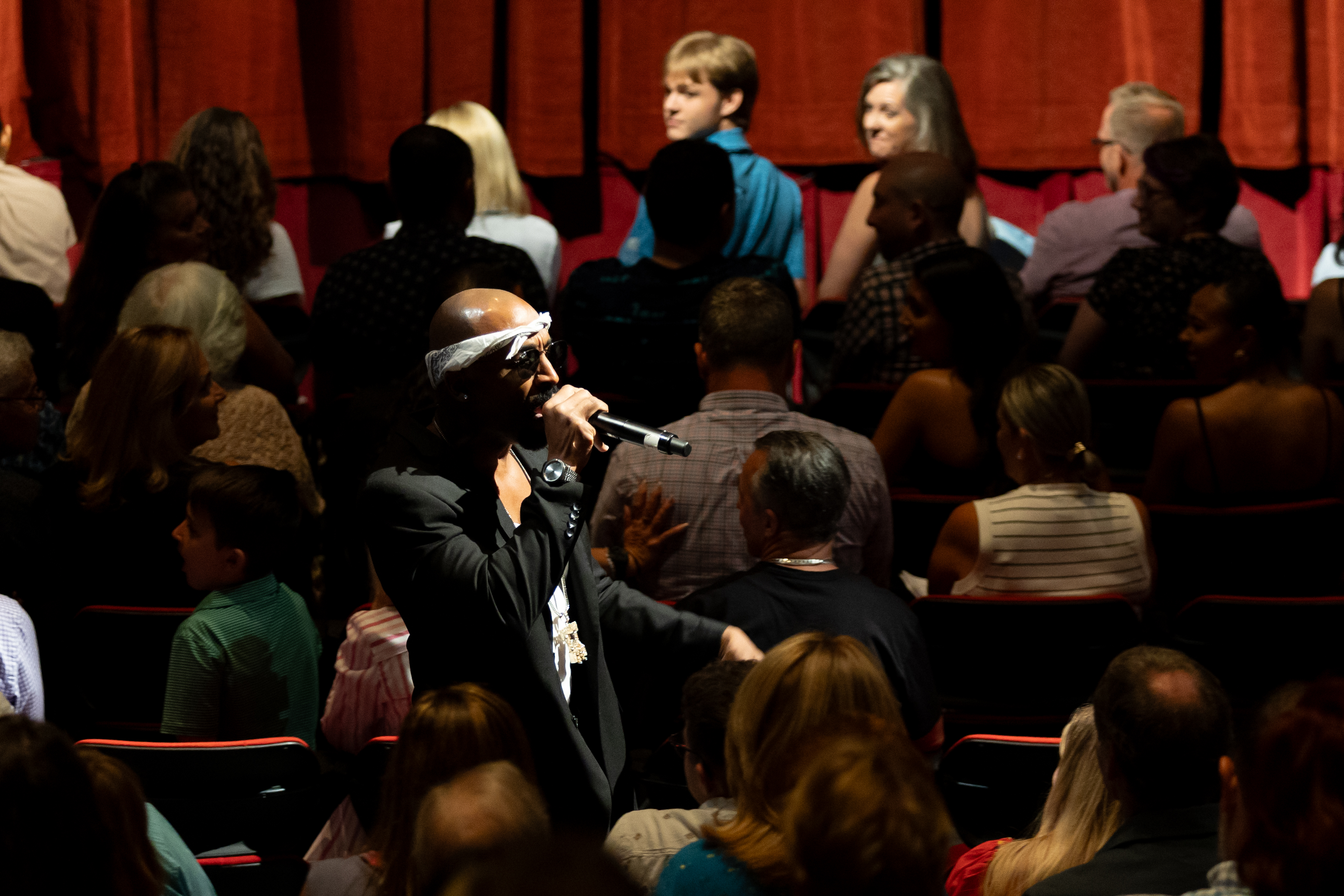 Josh Harraway as Tupac performing in the crowd